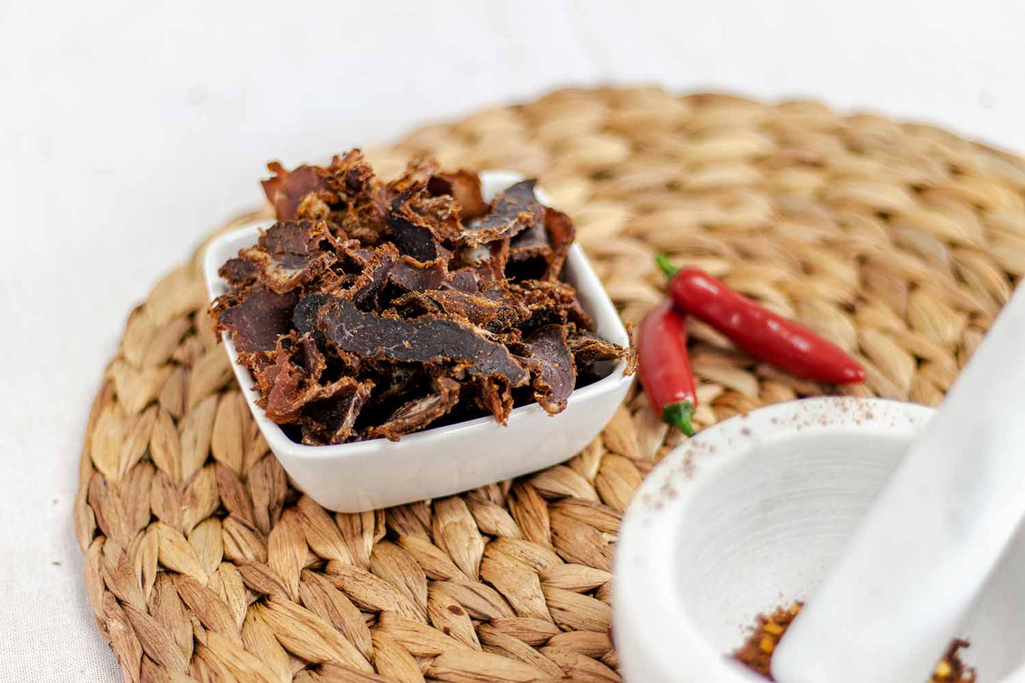 Crackly's Sliced Chili 50g (10 pack) - Our sliced chili biltong offers a spicy punch that's not fierce. It marinades for 2 days in our secret Binge-Brine, packed with traditional goodness.